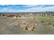 An aerial view shows community amenities, including playground, landscaping and green spaces throughout the neighborhood at 6055 Point Rider Cir, Castle Rock, CO 80104