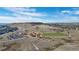 An elevated view of a planned community featuring a soccer field, parking and recreation center in a serene setting at 6055 Point Rider Cir, Castle Rock, CO 80104