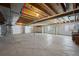 Unfinished basement space with open layout and visible ceiling joists at 6055 Point Rider Cir, Castle Rock, CO 80104