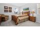 Comfortable bedroom with a large wooden bed frame, neutral color scheme, and ample natural light at 6055 Point Rider Cir, Castle Rock, CO 80104