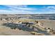 Aerial view of the community center featuring a pool and expansive parking lot at 6055 Point Rider Cir, Castle Rock, CO 80104