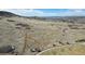 Aerial image of a dirt bike track meandering across a scenic landscape at 6055 Point Rider Cir, Castle Rock, CO 80104