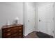 Entryway showcases wood floors, a dark wood dresser, and an exterior door at 6055 Point Rider Cir, Castle Rock, CO 80104