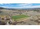 Aerial view of the community soccer field, with views of the surrounding hills at 6055 Point Rider Cir, Castle Rock, CO 80104