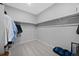 Spacious walk-in closet with ample hanging space and neutral carpeting, offering plenty of storage at 6055 Point Rider Cir, Castle Rock, CO 80104