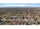 Expansive aerial view showcases the neighborhood with scenic mountain backdrop in the distance at 1746 Shavano St, Longmont, CO 80504