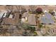 An aerial view of the house featuring a spacious yard and a wooden deck with pergola at 1746 Shavano St, Longmont, CO 80504