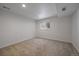 Bright bedroom featuring neutral carpeting, crisp white walls, and a window providing ample natural light at 1746 Shavano St, Longmont, CO 80504