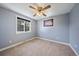 Cozy bedroom with natural light and ceiling fan at 1746 Shavano St, Longmont, CO 80504