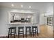 Modern kitchen with breakfast bar, stainless steel appliances, and granite countertops at 1746 Shavano St, Longmont, CO 80504