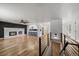 Open floor plan with hardwood floors, a fireplace, and eat in kitchen with bar seating at 1746 Shavano St, Longmont, CO 80504