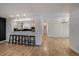 Living room featuring hardwood floors and breakfast bar at 1746 Shavano St, Longmont, CO 80504