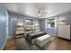 Stylish bedroom with hardwood floors and a plush bed at 1746 Shavano St, Longmont, CO 80504