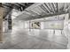 Unfinished basement with concrete floors, exposed ceiling, and ample space for customization at 6845 Fawn Path Way, Castle Pines, CO 80108