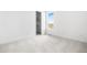 Clean, spacious bedroom with plush carpeting, a window view, and a convenient closet for storage at 6845 Fawn Path Way, Castle Pines, CO 80108