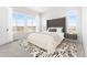 Beautifully decorated bedroom with large windows, carpet, bed and stylish decor at 6845 Fawn Path Way, Castle Pines, CO 80108