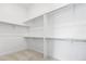 Spacious walk-in closet featuring built-in shelving and ample storage space at 6845 Fawn Path Way, Castle Pines, CO 80108