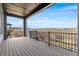Enjoy stunning views from the spacious covered deck, perfect for outdoor living and entertaining at 6845 Fawn Path Way, Castle Pines, CO 80108