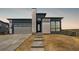 Beautiful new construction home boasts a modern design with stone accents and a welcoming entrance at 6845 Fawn Path Way, Castle Pines, CO 80108