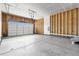 Spacious garage with concrete flooring, an automatic door, and ample room for storage at 6845 Fawn Path Way, Castle Pines, CO 80108