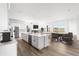 Contemporary kitchen featuring stainless appliances, an island, and an open floor plan at 6845 Fawn Path Way, Castle Pines, CO 80108