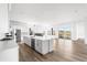 Modern kitchen with a central island, stainless steel appliances, and open layout at 6845 Fawn Path Way, Castle Pines, CO 80108