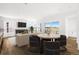 Bright living room with sliding glass doors, sleek furniture, and a modern fireplace for relaxing and entertaining at 6845 Fawn Path Way, Castle Pines, CO 80108
