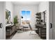 Bright office space with a large window, comfortable seating, and a stylish desk setup for productive work at 6845 Fawn Path Way, Castle Pines, CO 80108