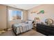 Cozy bedroom with a large window providing ample natural light at 19430 E 58Th Dr, Aurora, CO 80019