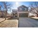 Charming two-story home with a well-manicured lawn and attached two car garage at 19430 E 58Th Dr, Aurora, CO 80019