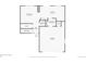 First floor plan featuring a living room, kitchen, laundry room, and garage at 19430 E 58Th Dr, Aurora, CO 80019