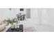 Open basement area featuring plush carpet, modern furniture, and ample lighting at 6211 W Fremont Pl, Littleton, CO 80128