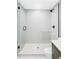 Modern bathroom featuring a glass-enclosed shower with sleek fixtures and tiling at 6211 W Fremont Pl, Littleton, CO 80128