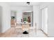 Bright dining room featuring a modern table and chairs with a view to kitchen at 6211 W Fremont Pl, Littleton, CO 80128