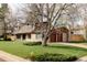 Charming home with a two-car garage, mature landscaping, and inviting curb appeal at 6211 W Fremont Pl, Littleton, CO 80128