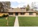Charming brick home featuring a well-manicured lawn and inviting front entrance at 6211 W Fremont Pl, Littleton, CO 80128