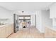 Open kitchen with view to living room, stainless steel fridge, and natural light at 6211 W Fremont Pl, Littleton, CO 80128
