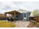 Backyard patio with pergola, outdoor seating, and access to the house, perfect for outdoor entertaining at 2401 E 35Th Ave, Denver, CO 80205