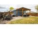 Backyard featuring a pergola, patio furniture, and grill, ideal for outdoor gatherings and relaxation at 2401 E 35Th Ave, Denver, CO 80205