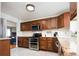 Modern kitchen with granite countertops, stainless steel appliances, and ample cabinet space at 2401 E 35Th Ave, Denver, CO 80205