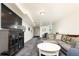 Spacious carpeted basement living area with a large sectional couch and media center at 2401 E 35Th Ave, Denver, CO 80205