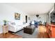 Cozy living room featuring hardwood floors and a comfortable seating arrangement at 2401 E 35Th Ave, Denver, CO 80205