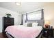 Inviting main bedroom with hardwood floors, ample natural light, and modern decor at 2401 E 35Th Ave, Denver, CO 80205