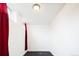 Room with a window and red curtain at 2401 E 35Th Ave, Denver, CO 80205