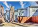Backyard with a wooden fence, large windows, and plenty of sunshine at 14120 E Warren Pl, Aurora, CO 80014