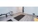 Finished basement with gray wood-look flooring and an area for exercise, fitness and more at 14120 E Warren Pl, Aurora, CO 80014