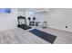 Finished basement gym featuring modern gray flooring and exercise equipment, perfect for home fitness at 14120 E Warren Pl, Aurora, CO 80014