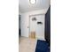 Bright bathroom with shower, linen closet, and neutral tile flooring at 14120 E Warren Pl, Aurora, CO 80014