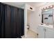 Modern bathroom featuring a shower, vanity, and a well-lit mirror at 14120 E Warren Pl, Aurora, CO 80014