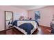 Bedroom featuring hardwood floors and a window at 14120 E Warren Pl, Aurora, CO 80014